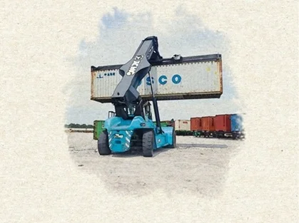 A blue reach stacker lifting a shipping container during a professional Reach Stacker Training certification session.
